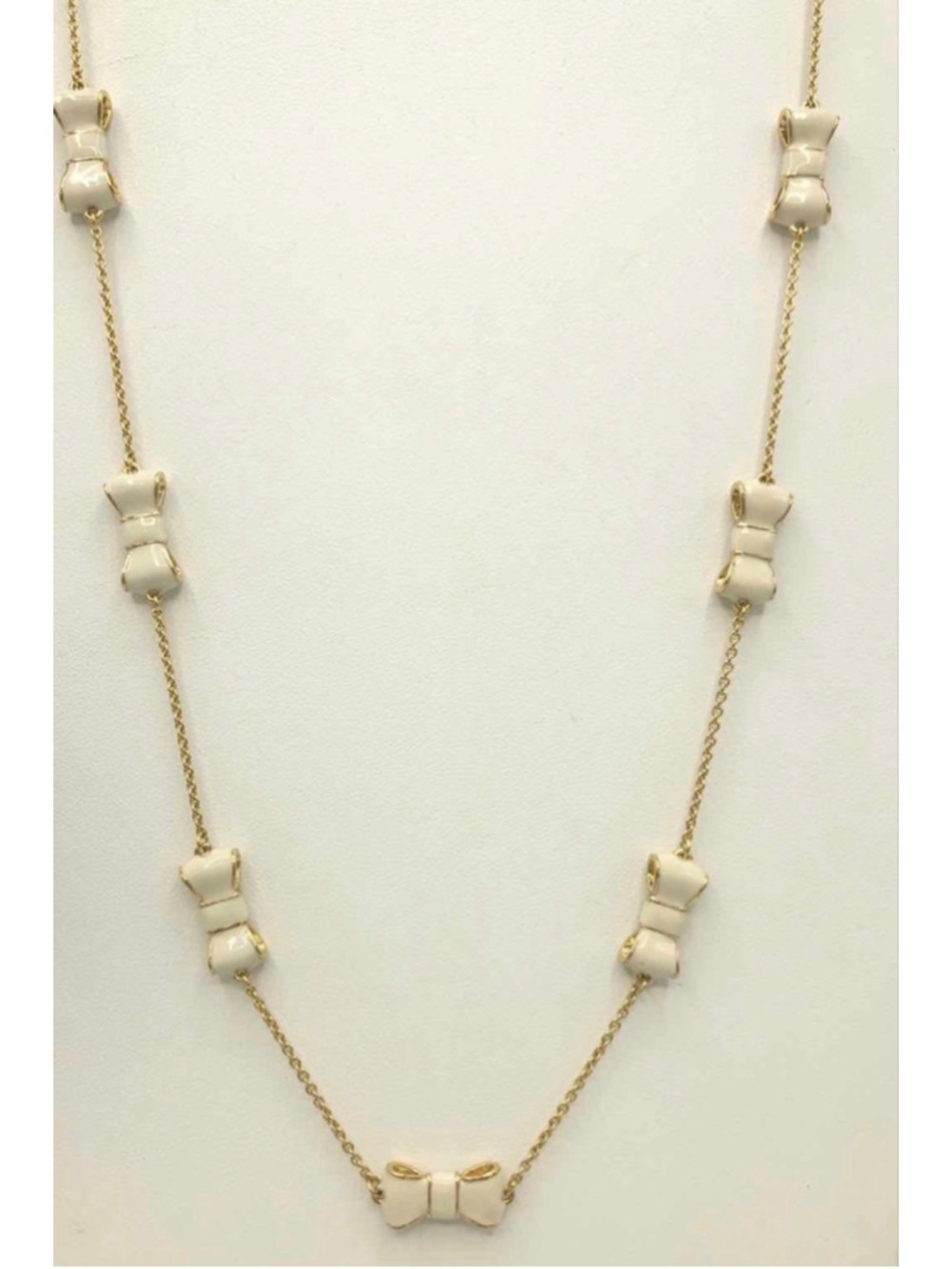 NWOT KATE SPADE Goldtone Cream Bow Necklace 16in length (32in total)